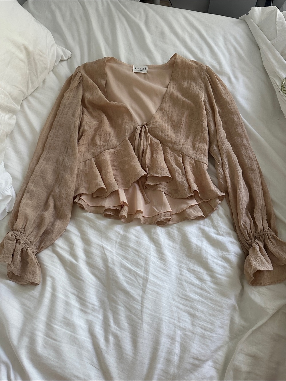 Solai the label top
